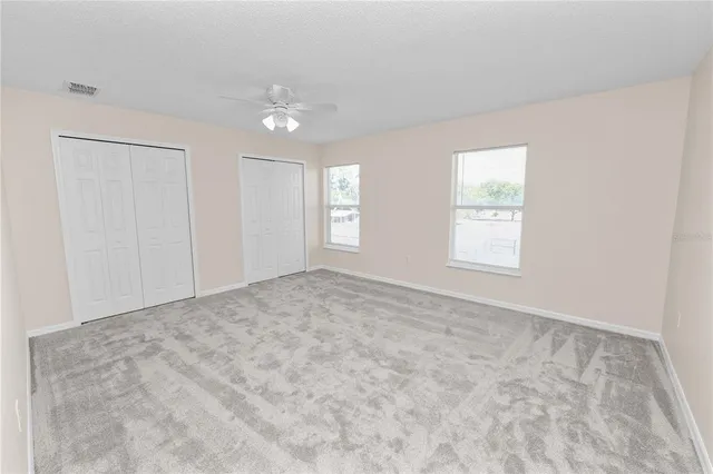 a view of a kitchen with a sink and a large window