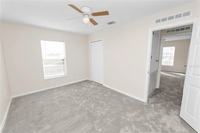 a view of a swimming pool and an outdoor seating