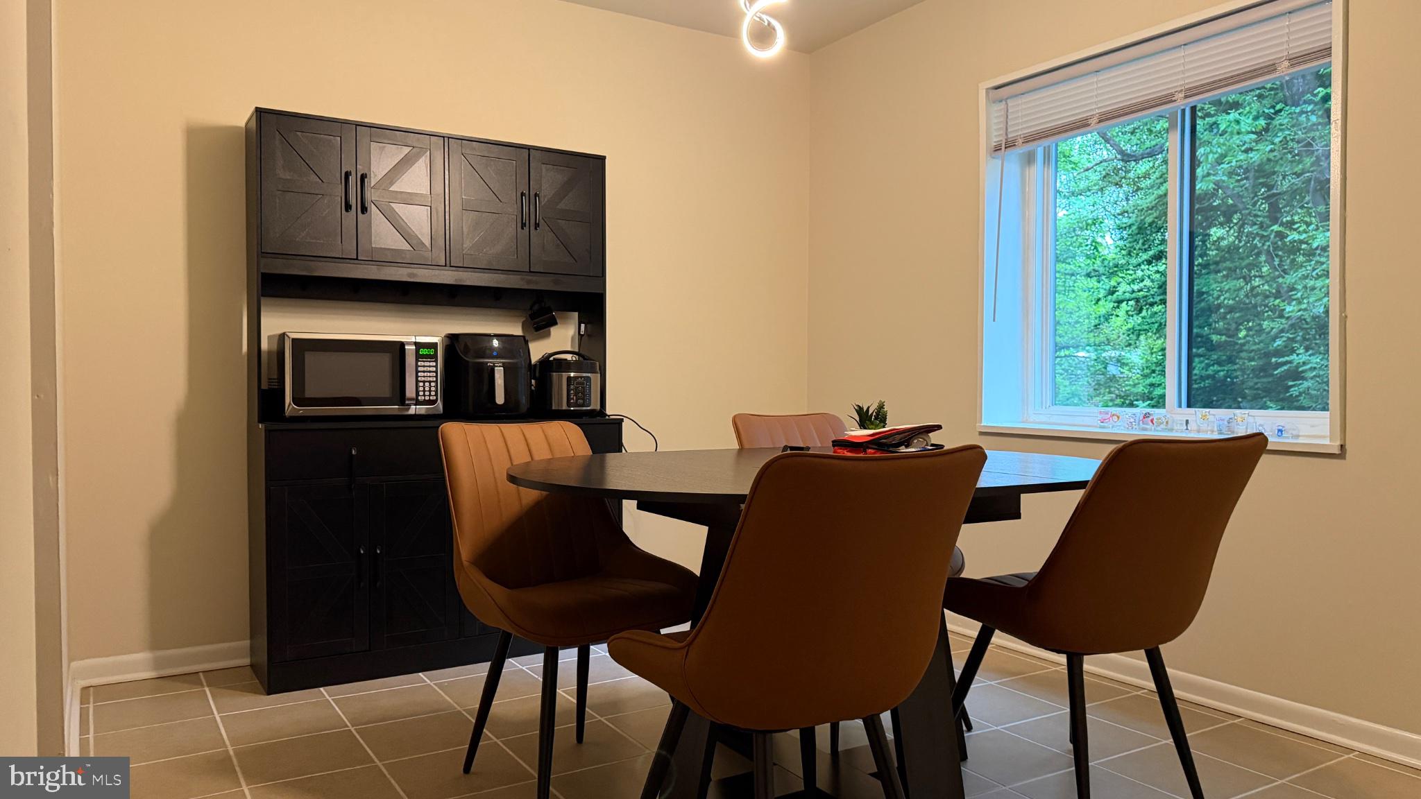 1407 Northgate Square, Unit 2C Reston, VA 20190 - Photo 11 of 18 Modern dining space with natural light.