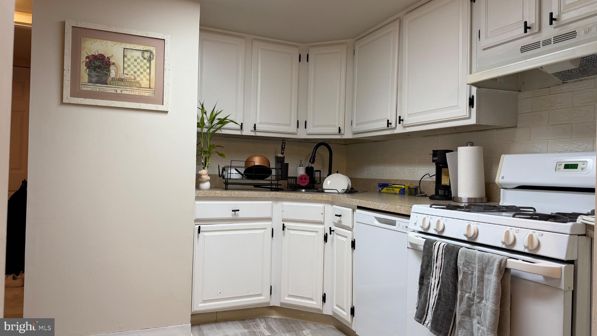 1407 Northgate Square, Unit 2C Reston, VA 20190 - Photo 13 of 18 Charming kitchen with modern flair.
