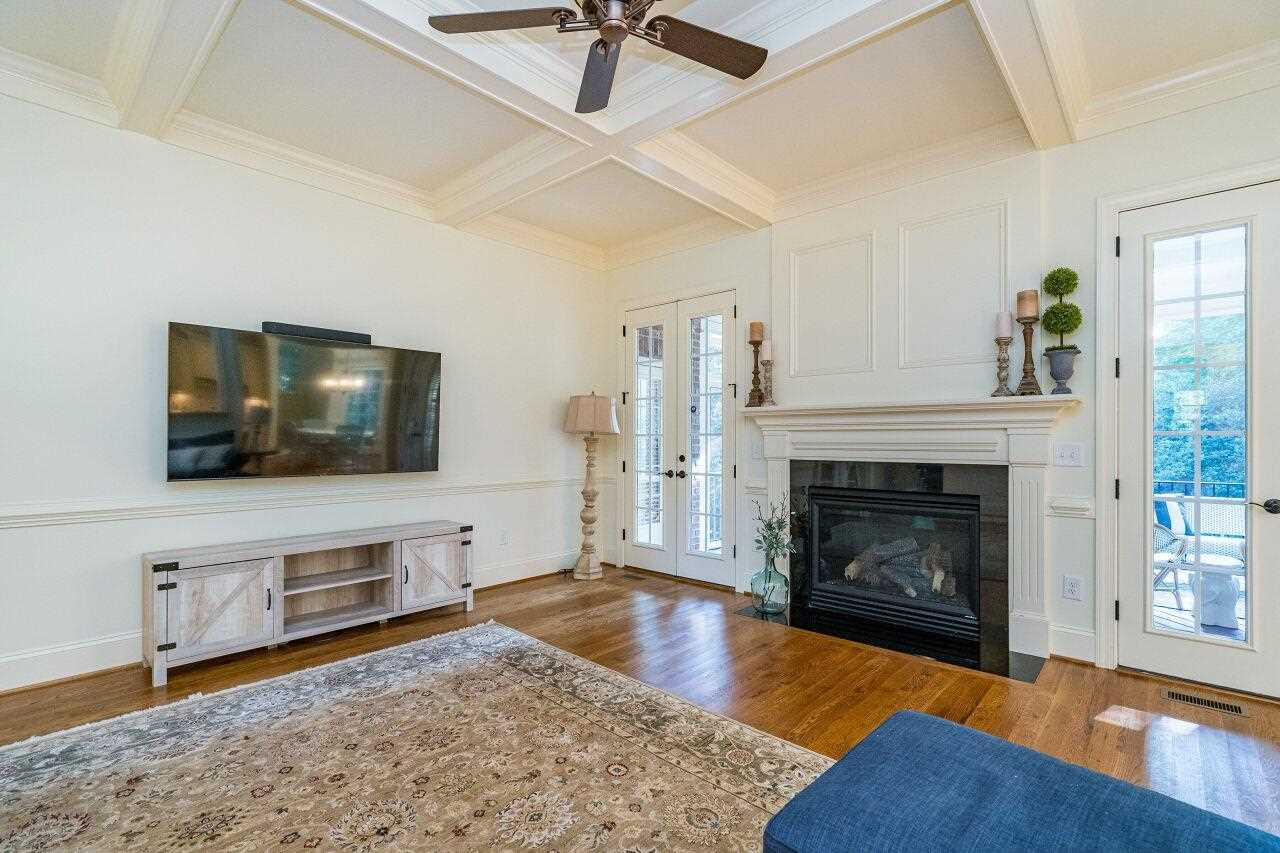 3820 Laurel Hills Road Raleigh, NC 27612 - Photo 7 of 30 Entertaining is a breeze with doors to the screened porch right off the living room! Living Room