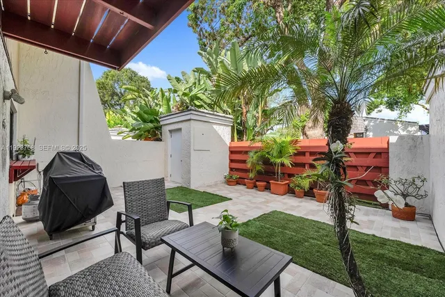 a backyard of a house with seating space