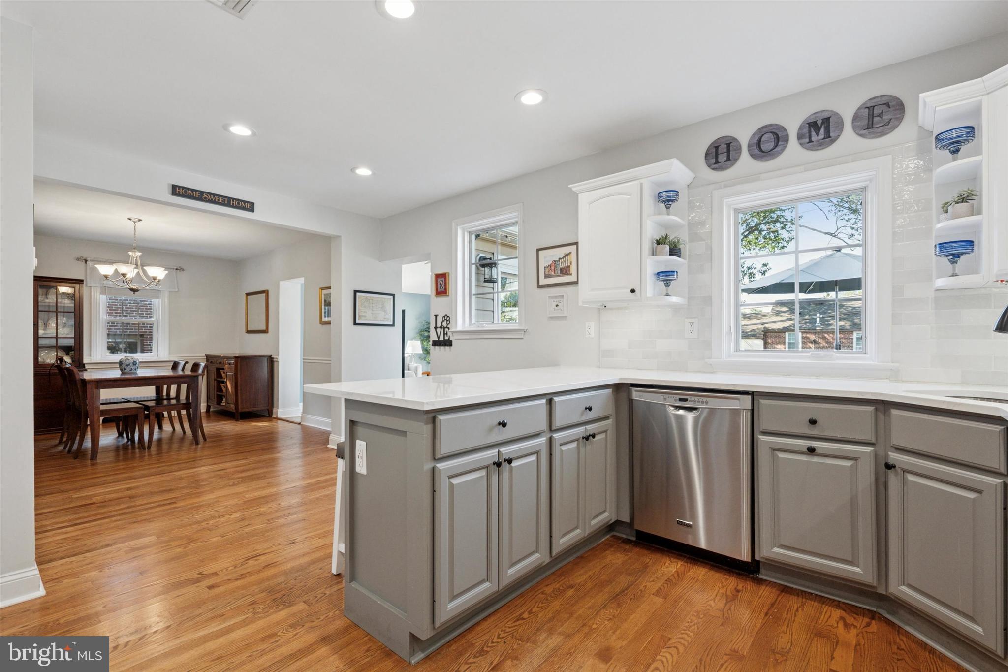 141 Friendship Road Drexel Hill, PA 19026 - Photo 14 of 34 a kitchen with sink cabinets and dining table