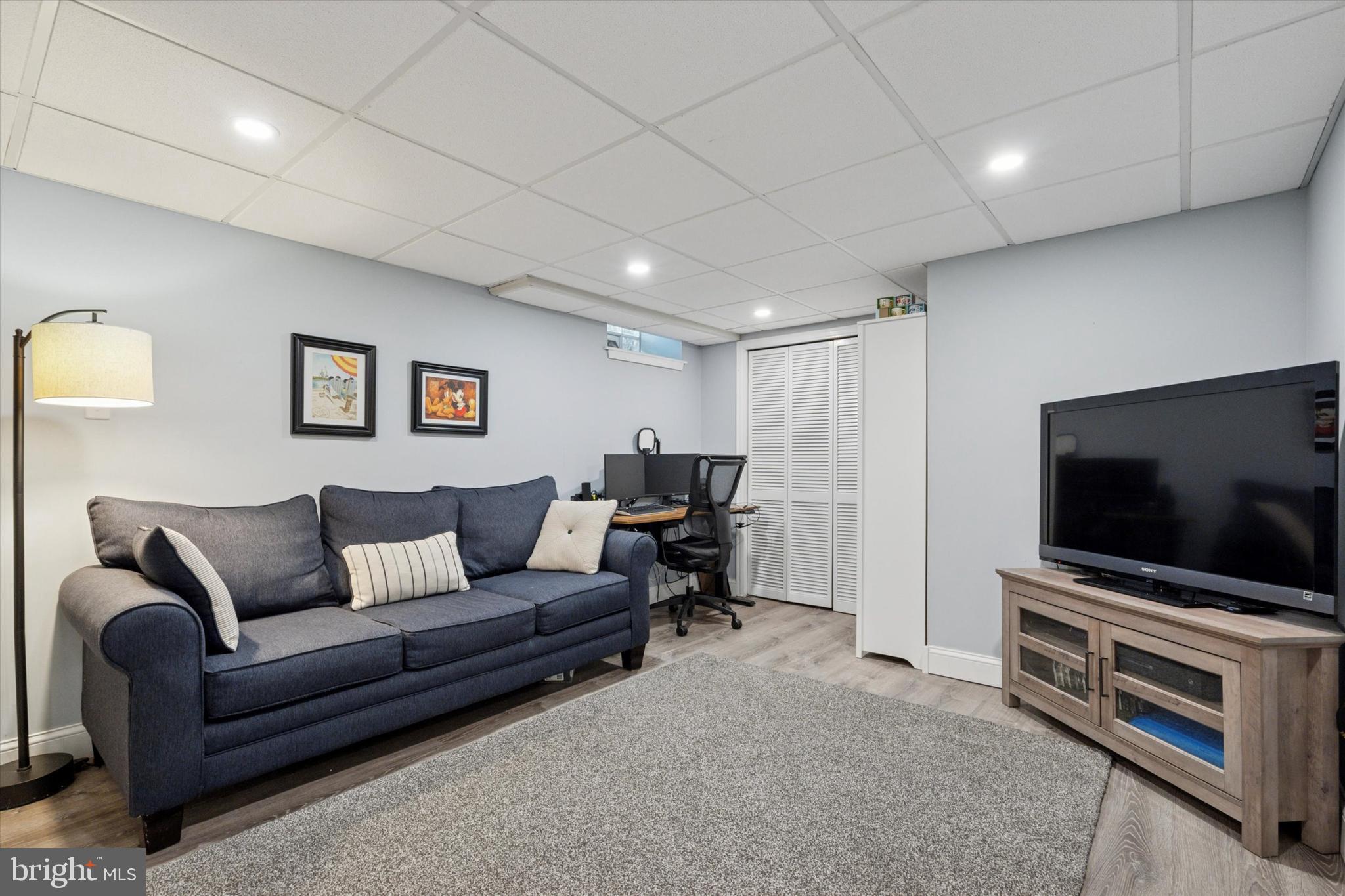 141 Friendship Road Drexel Hill, PA 19026 - Photo 27 of 34 a living room with furniture and a flat screen tv