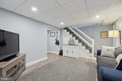 a room with furniture and stairs