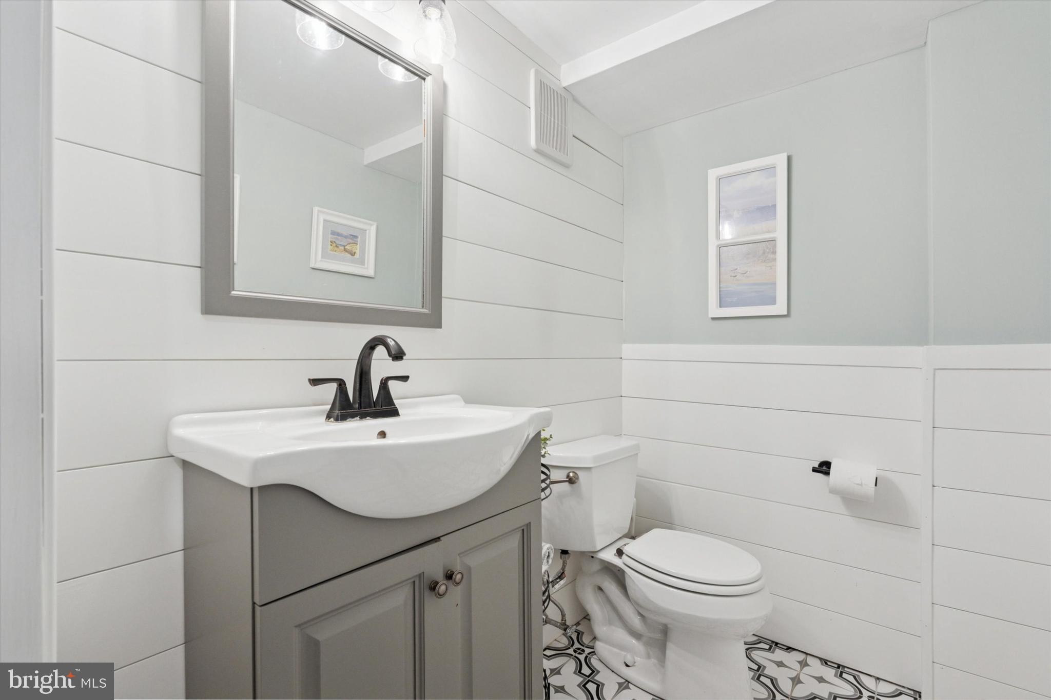 141 Friendship Road Drexel Hill, PA 19026 - Photo 29 of 34 a bathroom with a sink a toilet and mirror