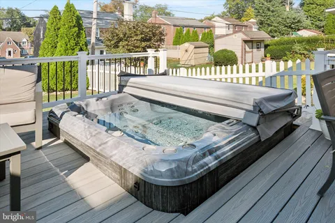 a view of a wooden deck with furniture