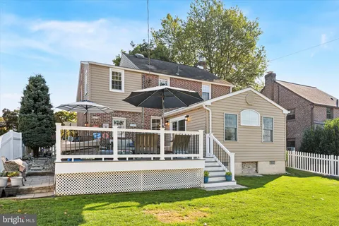 a house with swimming pool in front of it