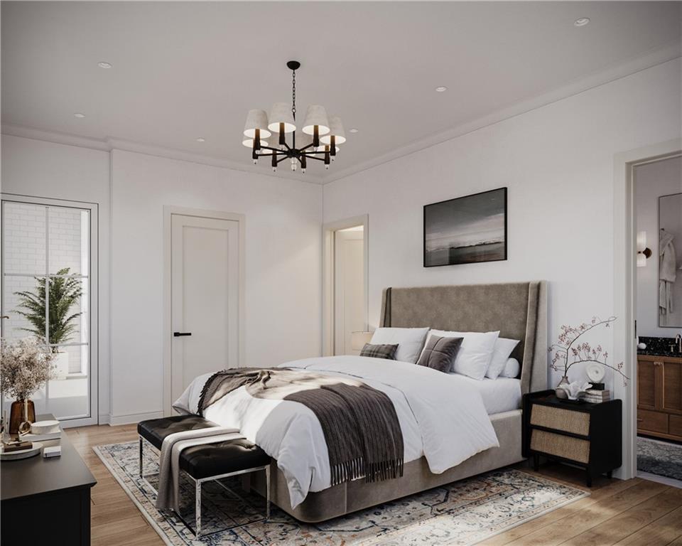 5804 Bryant Street, Unit 201 Pittsburgh, PA 15206 - Photo 4 of 6 a bedroom with bed and a chandelier