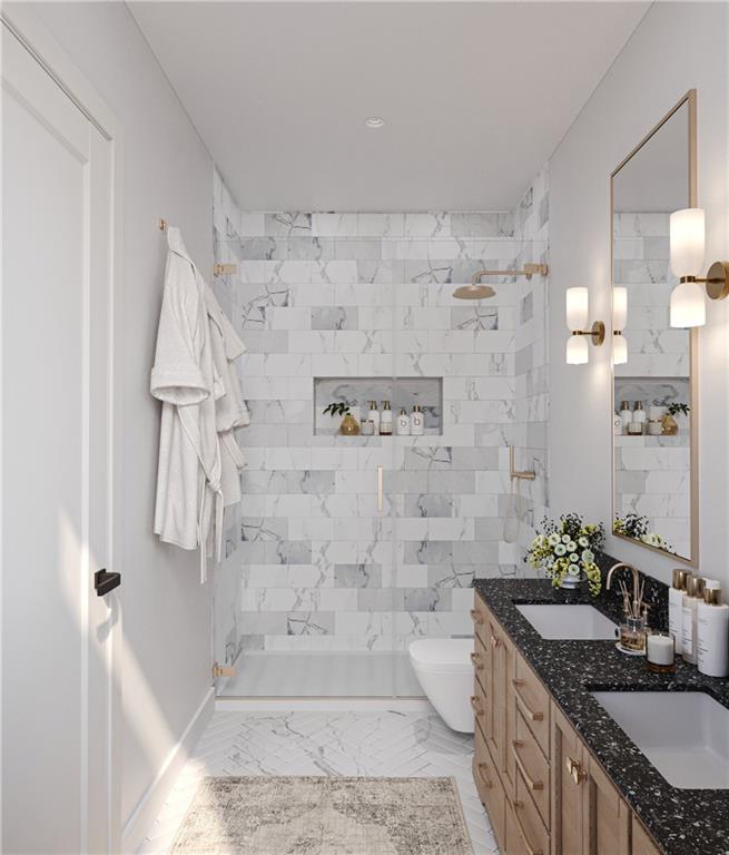 5804 Bryant Street, Unit 201 Pittsburgh, PA 15206 - Photo 5 of 6 a bathroom with a granite countertop shower a sink and a mirror