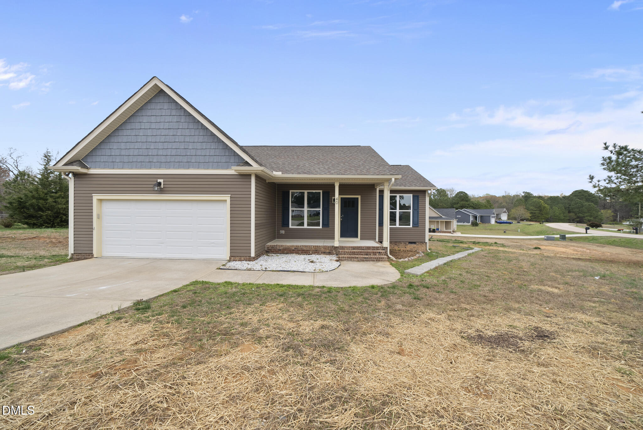 front view of a house with a yard