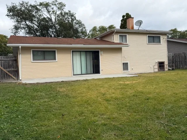 a house that has a tree in front of it