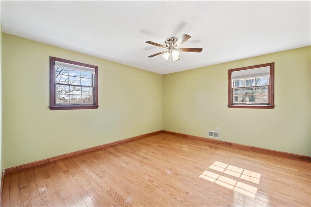 320 Malone Ridge Road Washington, PA 15301 - Photo 20 of 31 a view of an empty room with a window and a painting on the wall