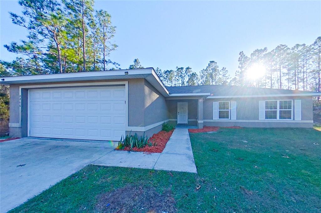 front view of a house with a yard