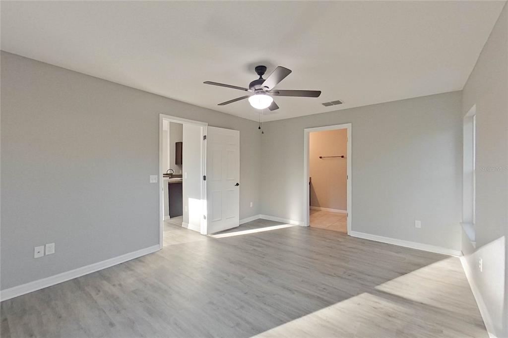 8806 Southwest 135th Street Road Ocala, FL 34473 - Photo 14 of 20 a view of an empty room with a window