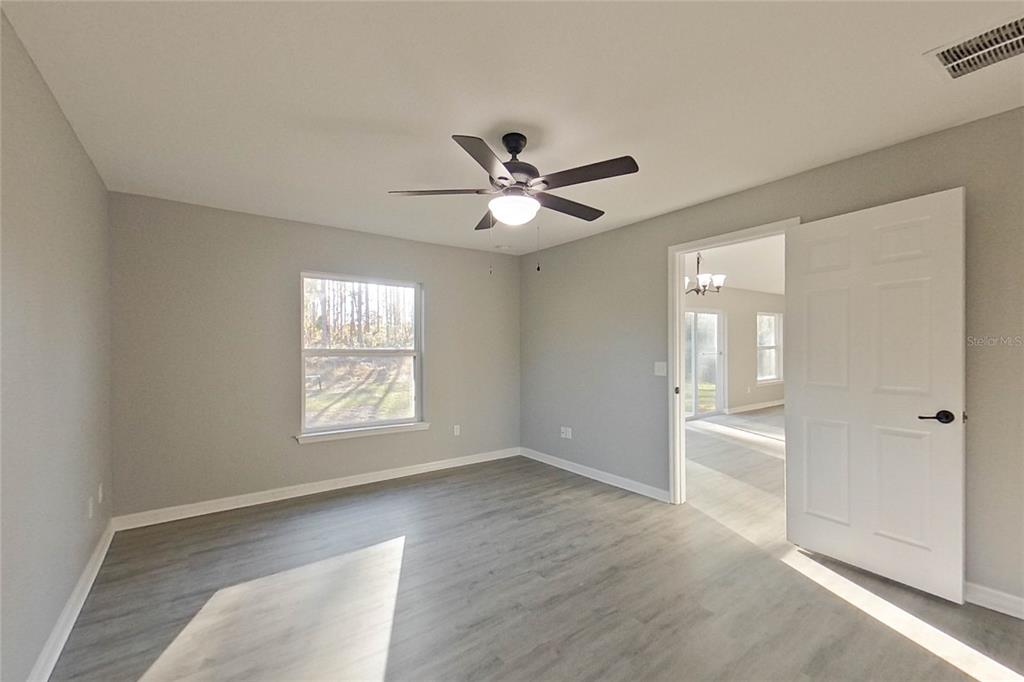 8806 Southwest 135th Street Road Ocala, FL 34473 - Photo 15 of 20 a view of an empty room with a window