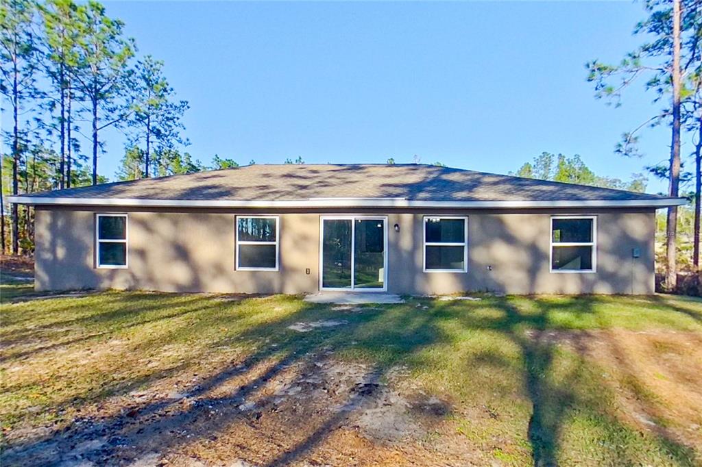 8806 Southwest 135th Street Road Ocala, FL 34473 - Photo 20 of 20 a view of a house with a yard