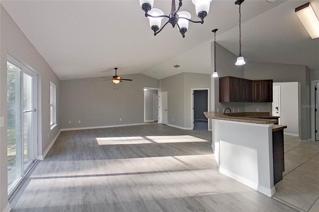 8806 Southwest 135th Street Road Ocala, FL 34473 - Photo 6 of 20 a view of an empty room and kitchen view