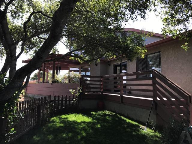 2191 Tularosa Road Lompoc, CA 93436 - Photo 20 of 29 a view of a patio with table and chairs plants and large trees