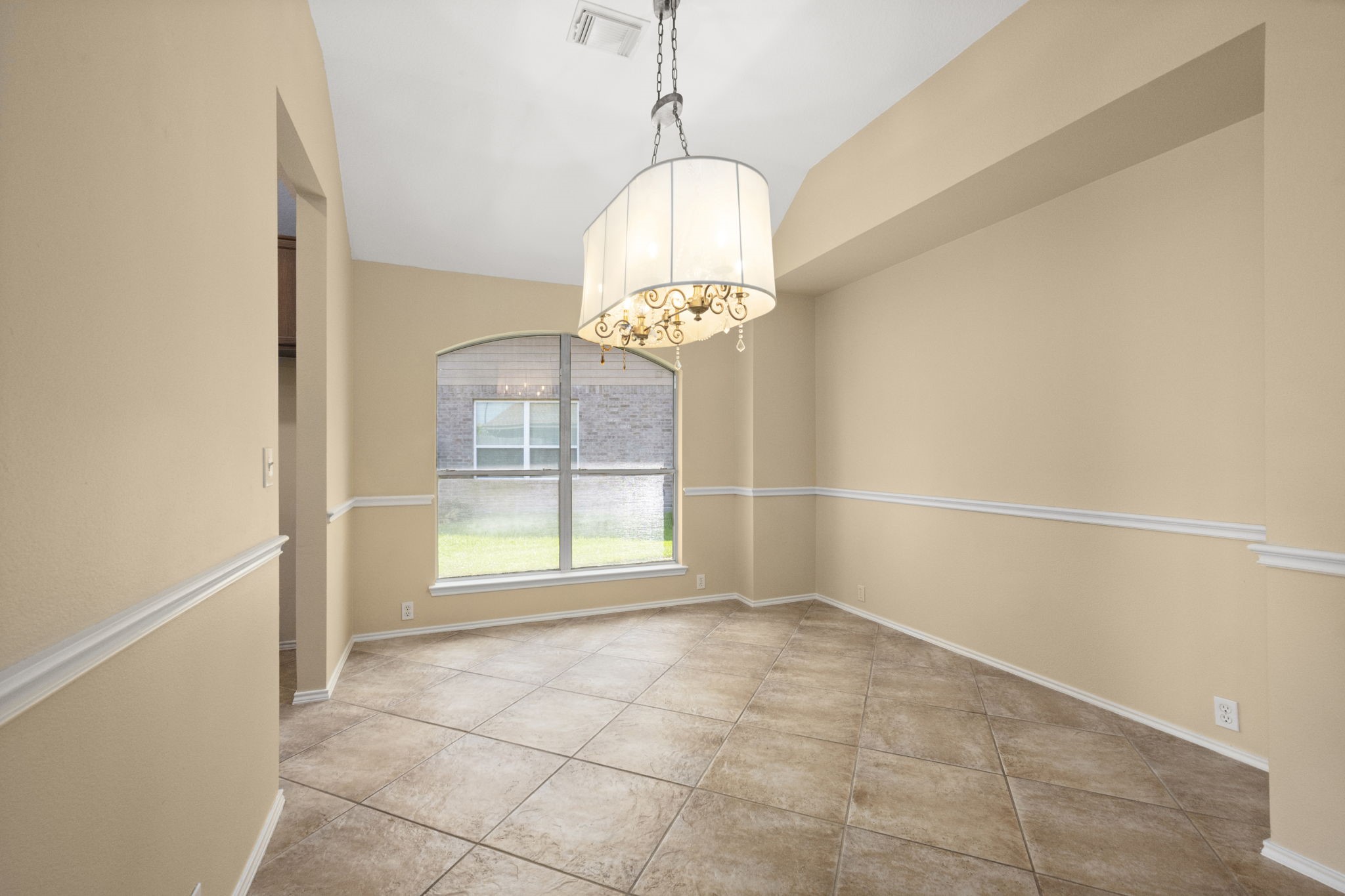 2007 Louetta Spring Drive Spring, TX 77388 - Photo 16 of 50 Perfect for everything from holiday dinners to intimate gatherings, the formal dining room features elegant proportions, high ceilings, and plenty of natural light.A recessed space for a sideboard, makes this dining room the perfect fit for your table under the glowing lights of the designer chandelier.