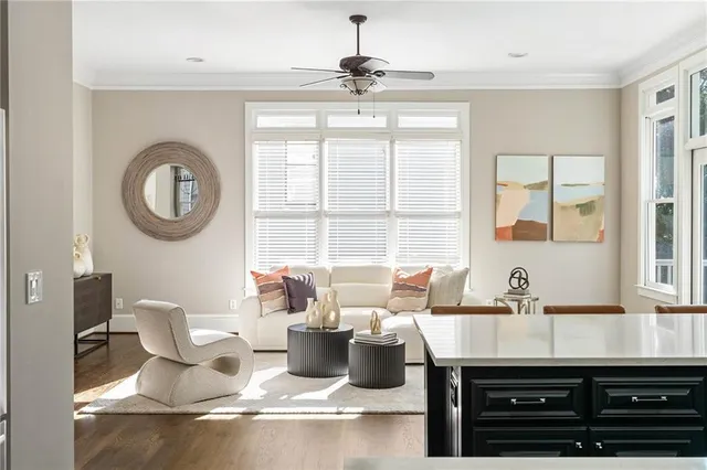 a dining room with wooden floor a glass table and chairs