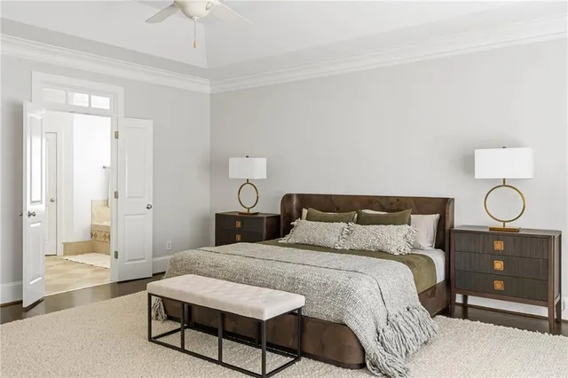 a bedroom with a bed and chandelier
