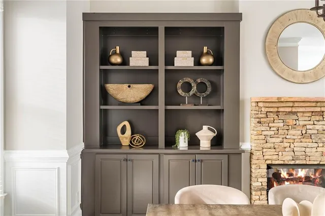 a shelf with dining room and wooden door