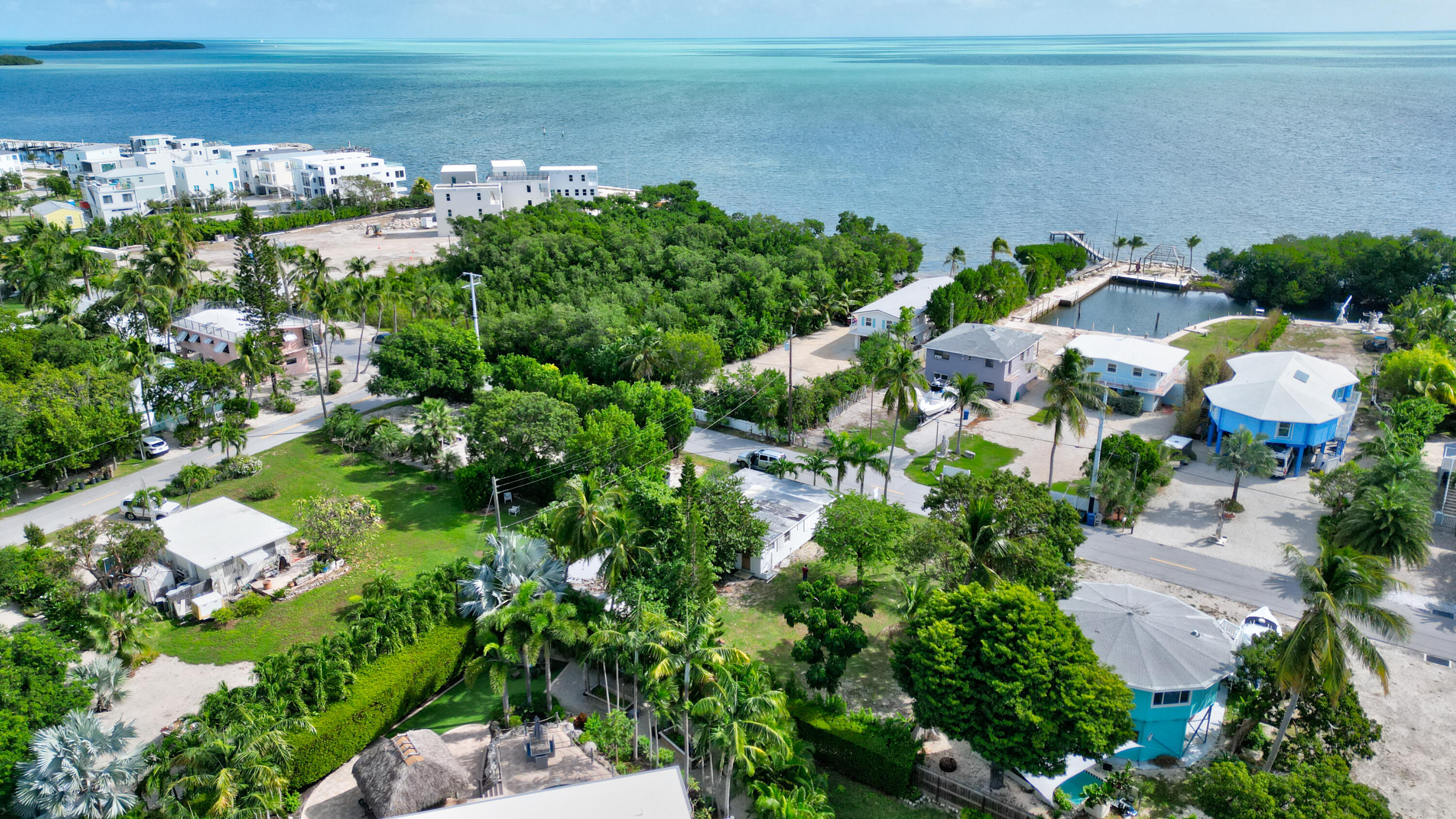 15 Seaside Avenue Key Largo, FL 33037 - Photo 17 of 55 a picture of street with lots of residential buildings and lake view