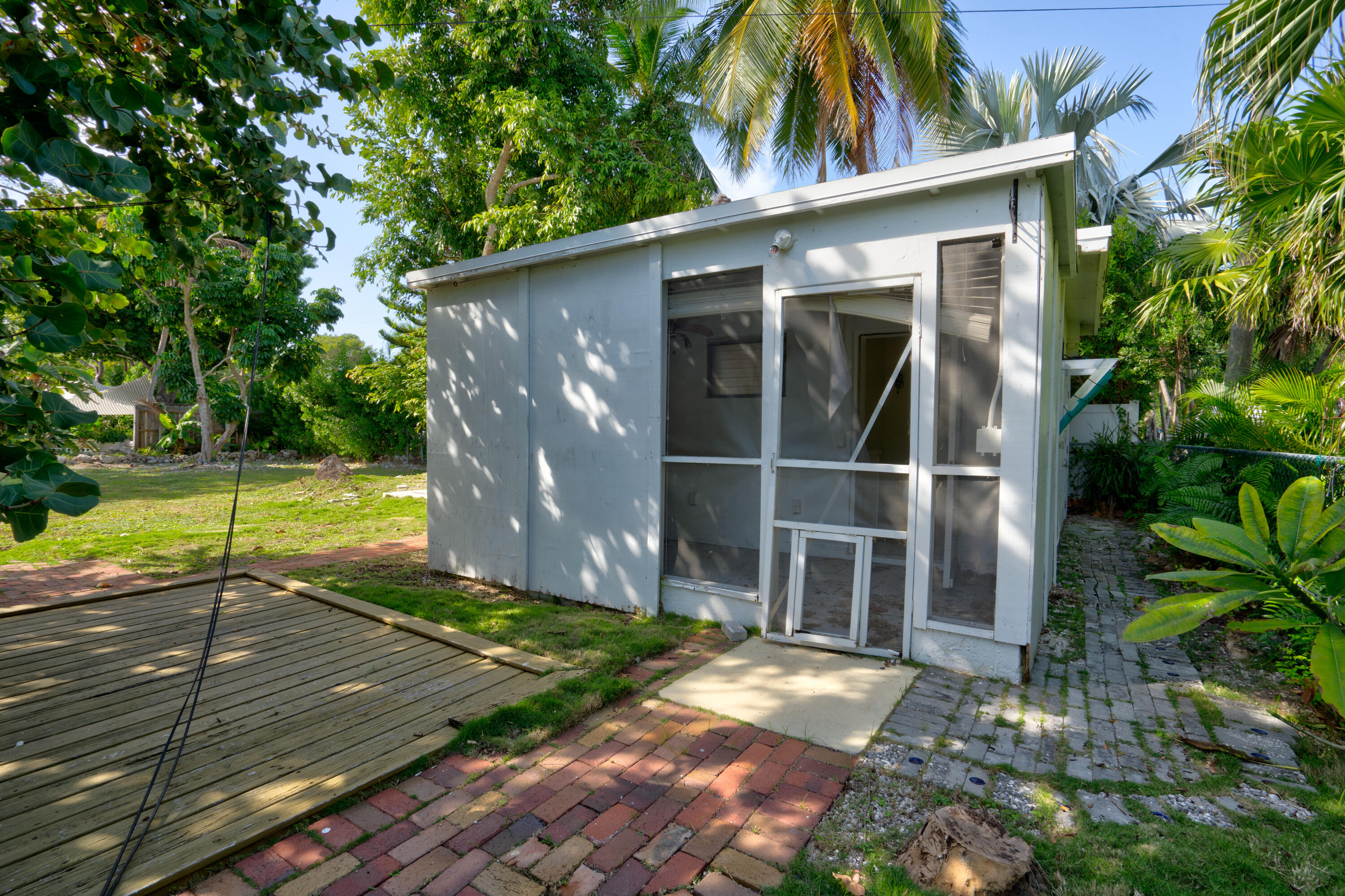 15 Seaside Avenue Key Largo, FL 33037 - Photo 28 of 55 a view of a house with a yard