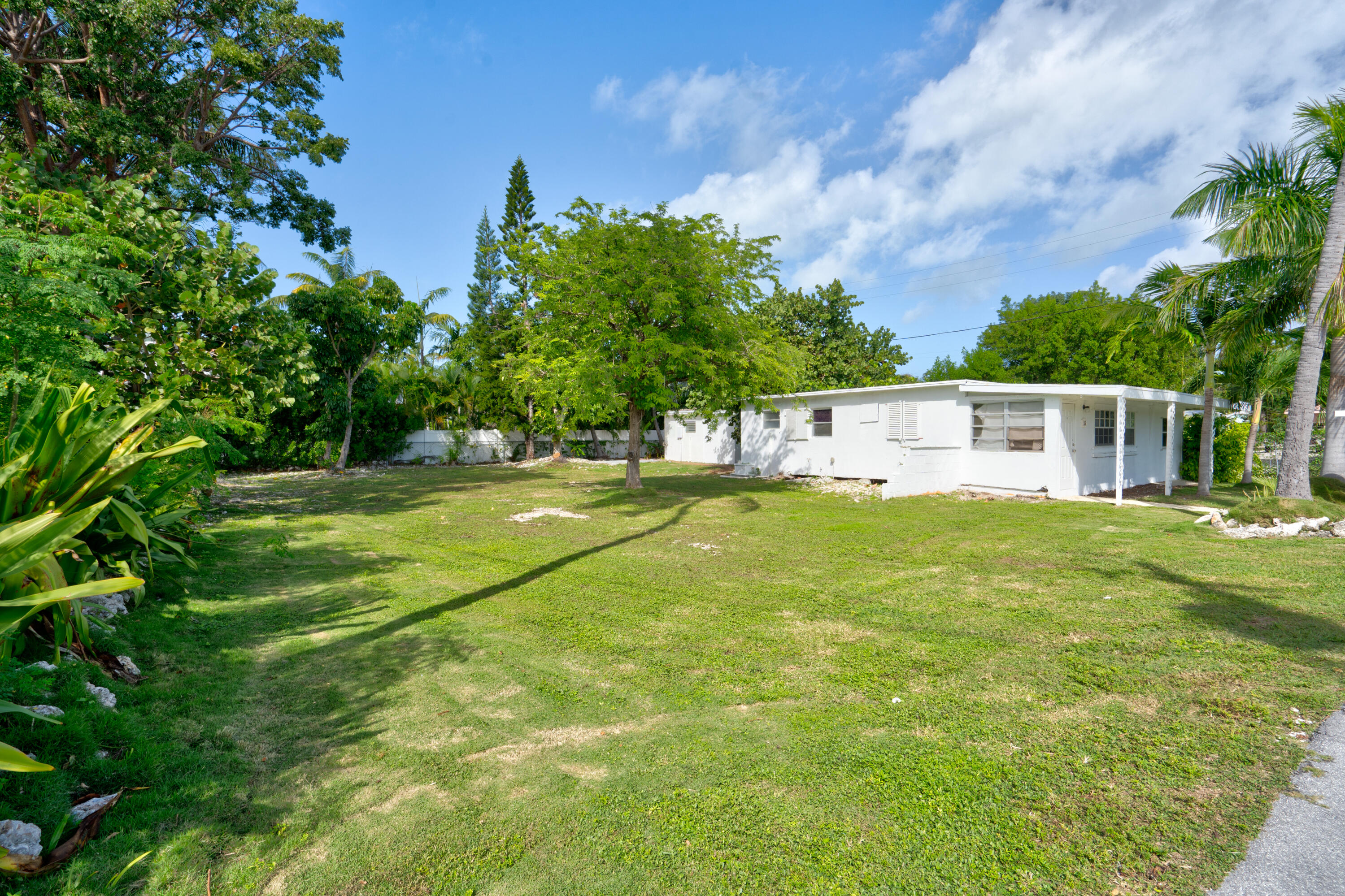 15 Seaside Avenue Key Largo, FL 33037 - Photo 36 of 55 a view of a house with a backyard