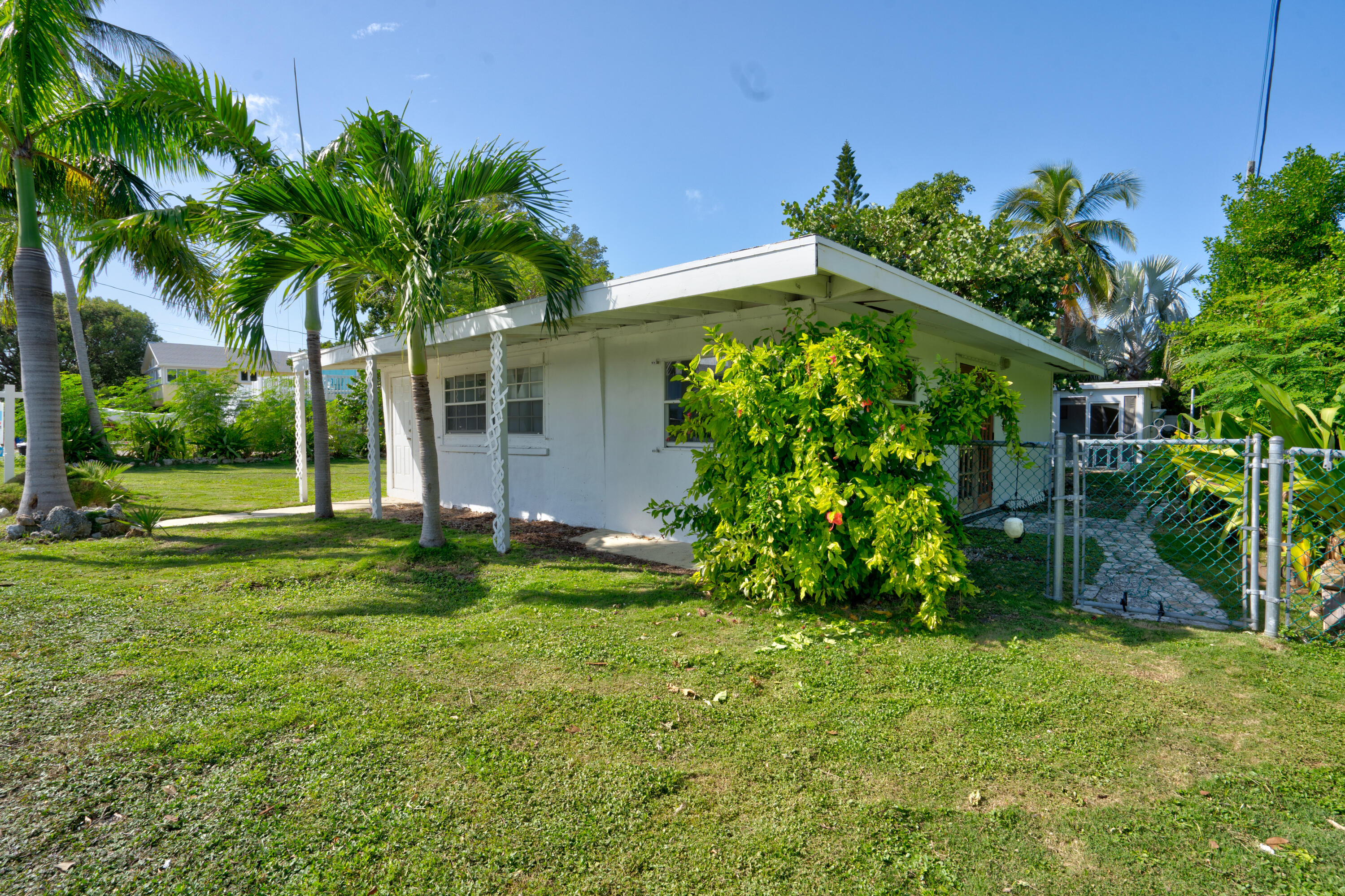 15 Seaside Avenue Key Largo, FL 33037 - Photo 39 of 55 a front view of a house with garden