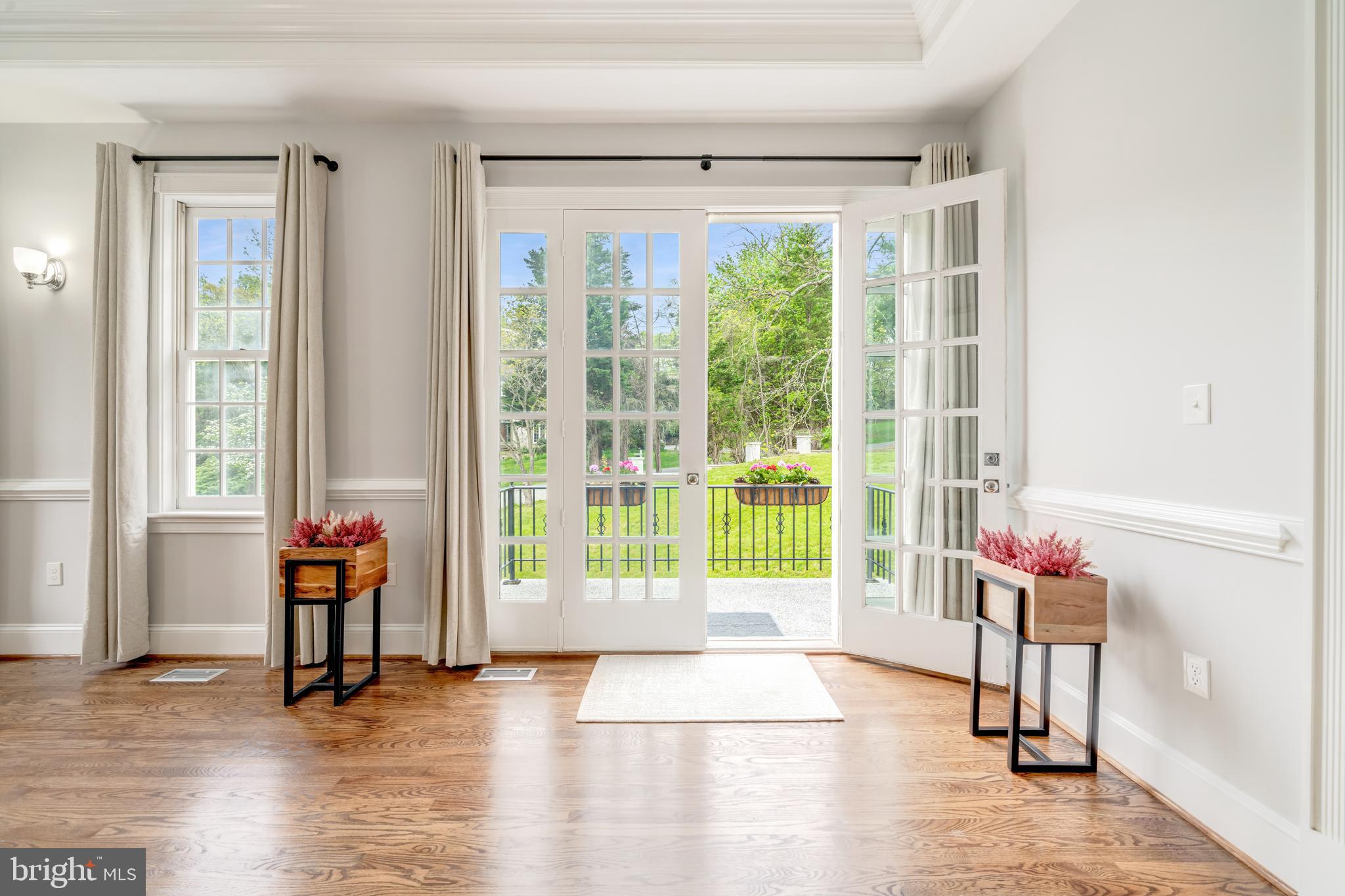 1111 Towlston Road McLean, VA 22102 - Photo 15 of 49 a living room filled with furniture and a floor to ceiling window