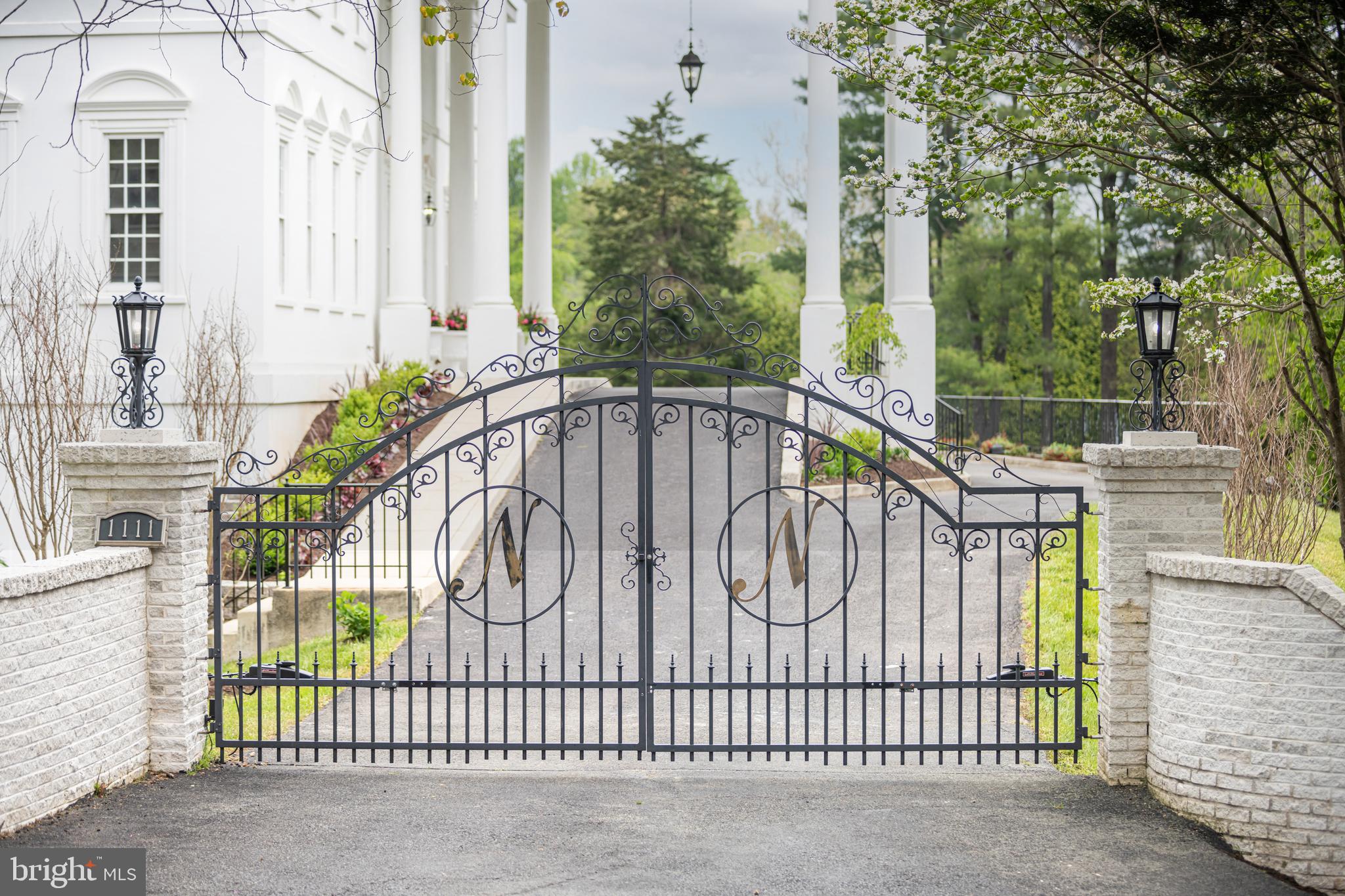 1111 Towlston Road McLean, VA 22102 - Photo 2 of 49 a white building with a trees in the background
