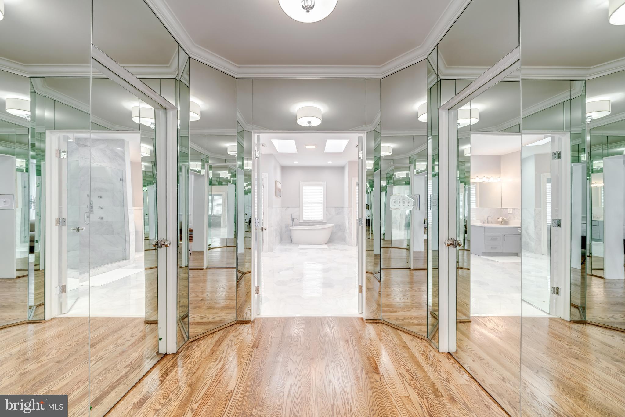 1111 Towlston Road McLean, VA 22102 - Photo 24 of 49 a view of a hallway with wooden floor and a glass door shower