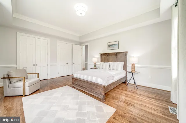 a bedroom with a bed and a couch