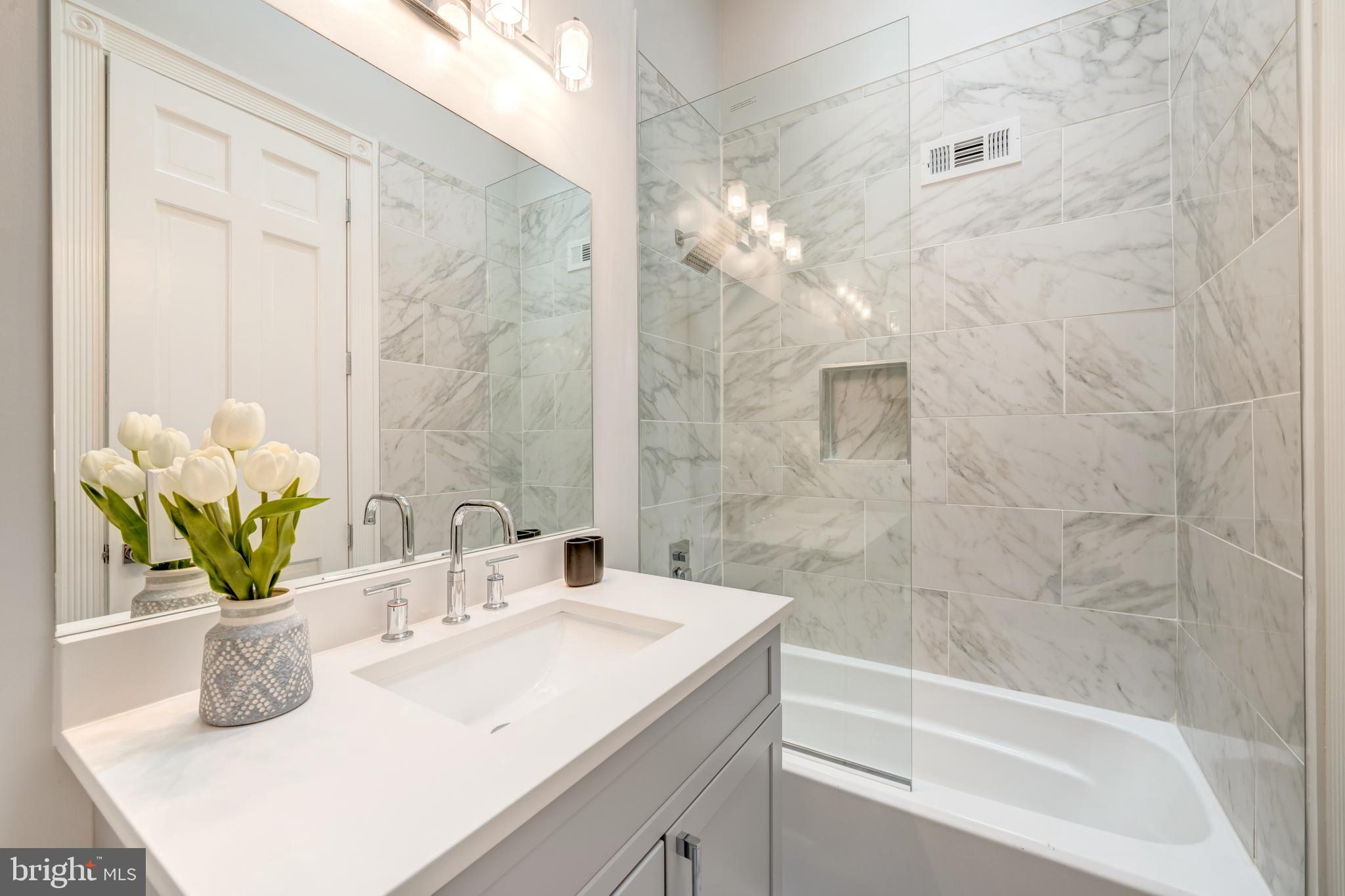 1111 Towlston Road McLean, VA 22102 - Photo 28 of 49 a bathroom with a sink a vanity and a bathtub
