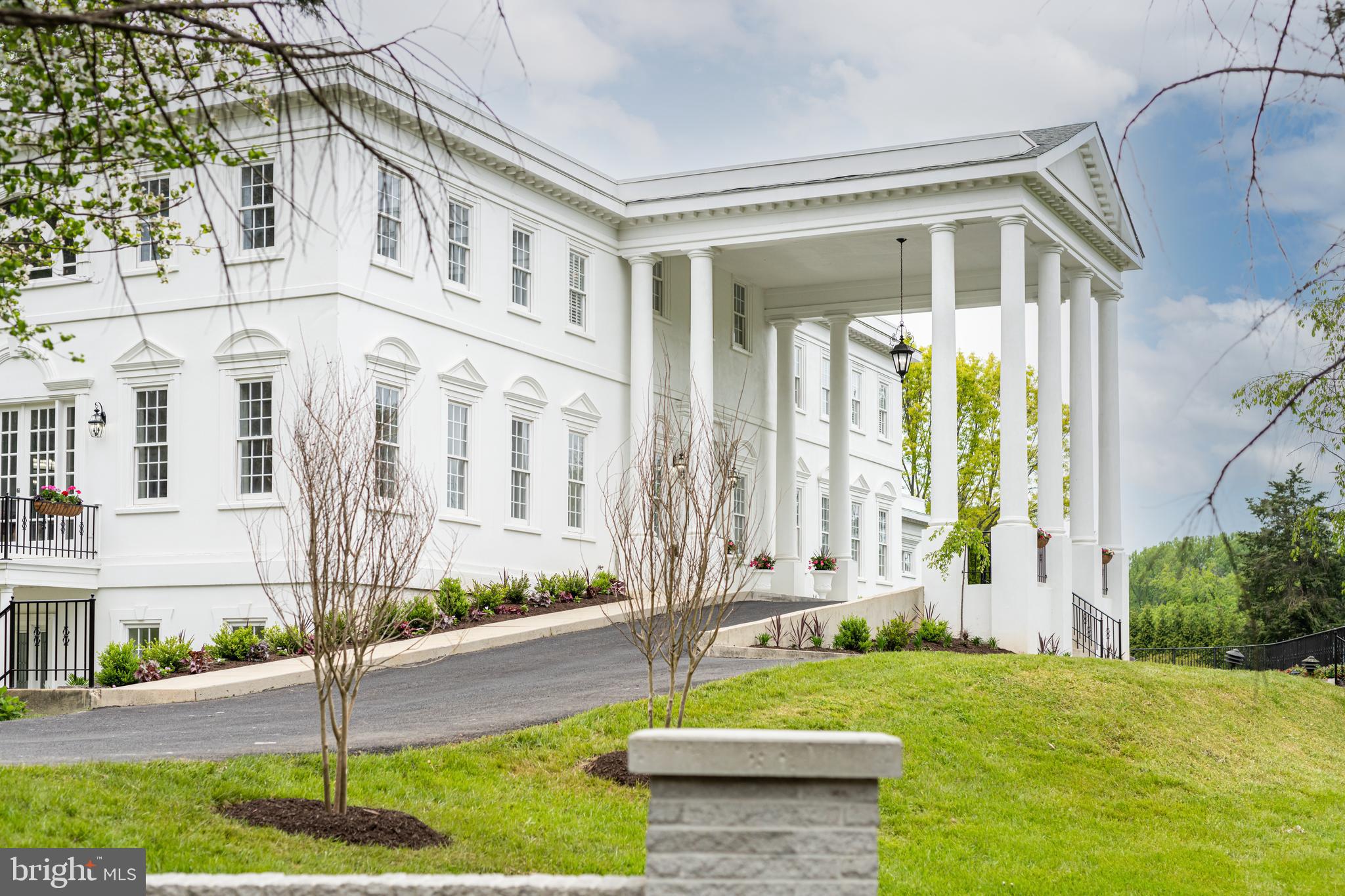 1111 Towlston Road McLean, VA 22102 - Photo 3 of 49 a front view of a house with a garden and plants