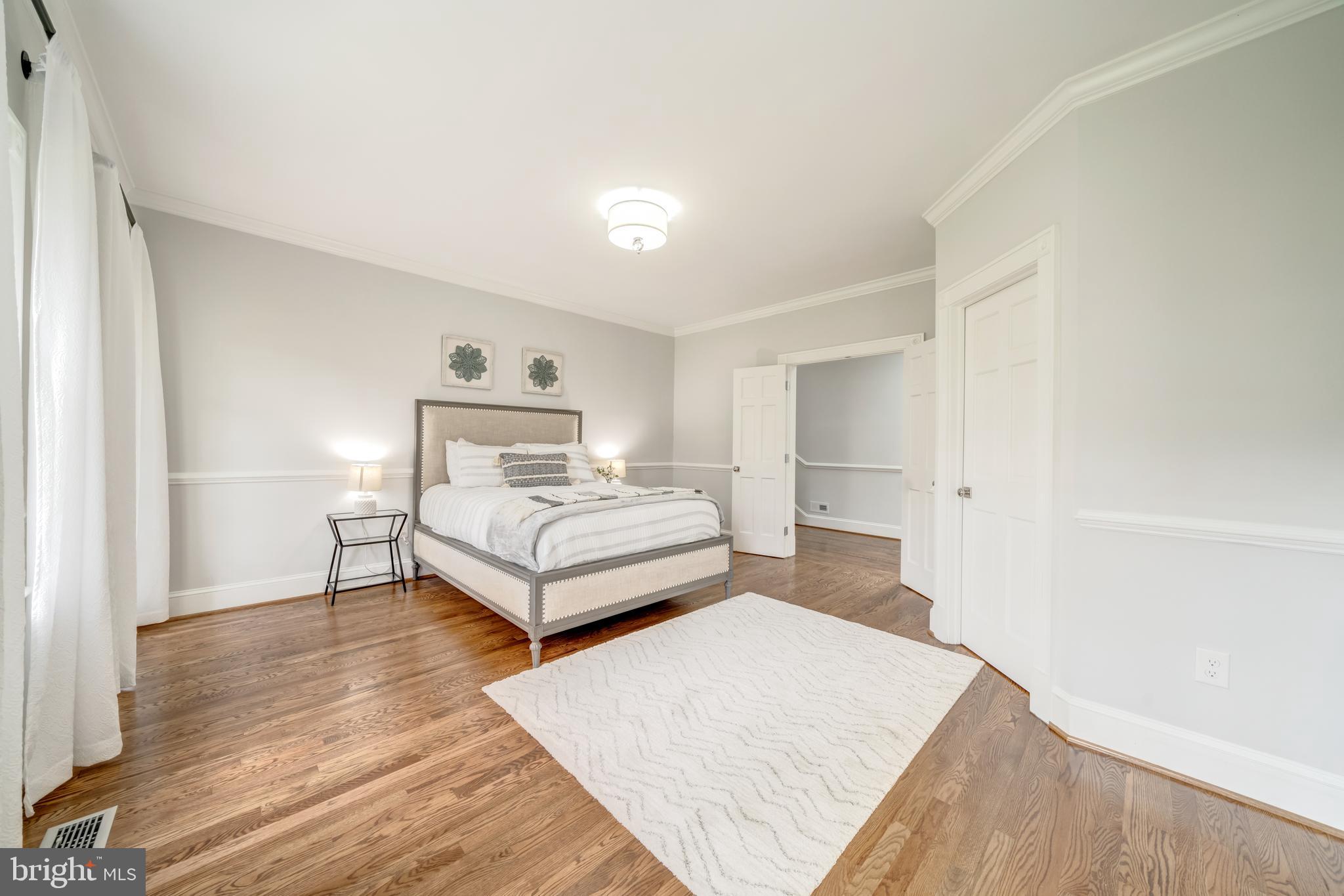 1111 Towlston Road McLean, VA 22102 - Photo 33 of 49 a bedroom with a bed and wooden floor