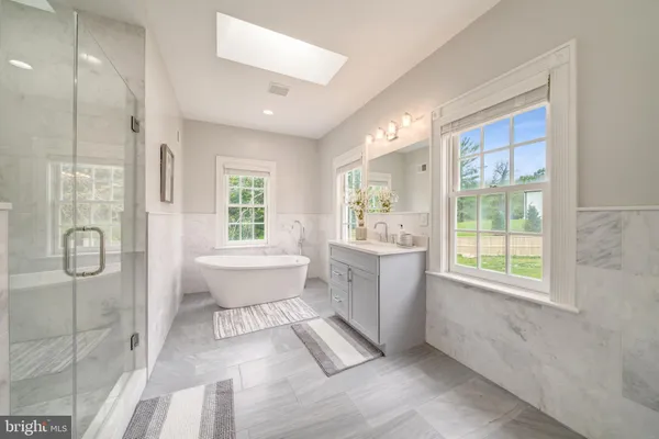 a bathroom with a toilet sink and bathtub