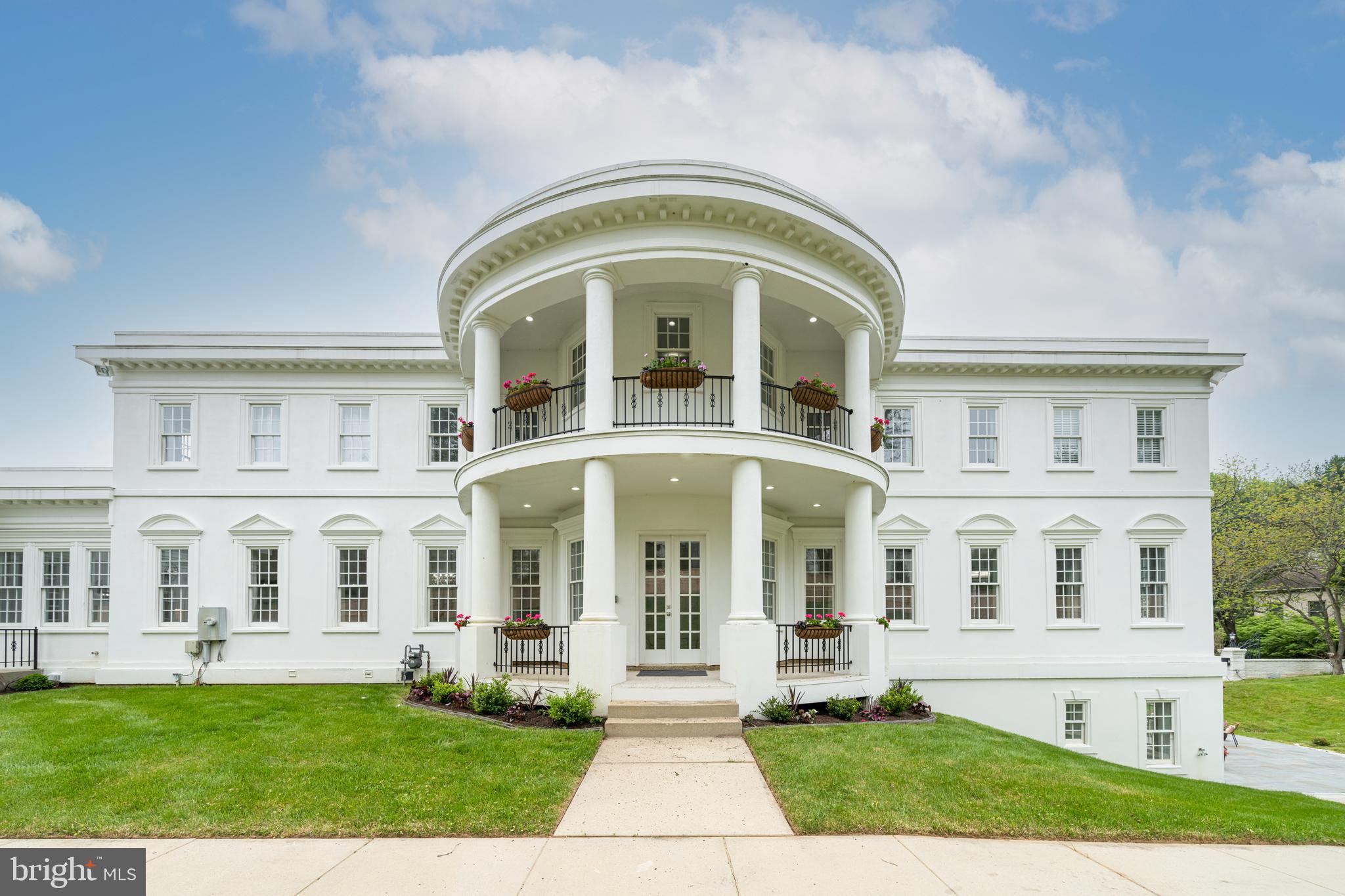1111 Towlston Road McLean, VA 22102 - Photo 4 of 49 a front view of a house with a garden