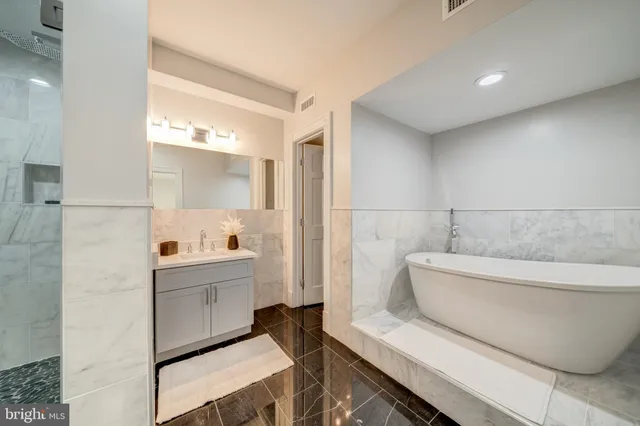 a bathroom with a bathtub and a sink