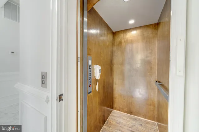 a view of a bathroom from a hallway