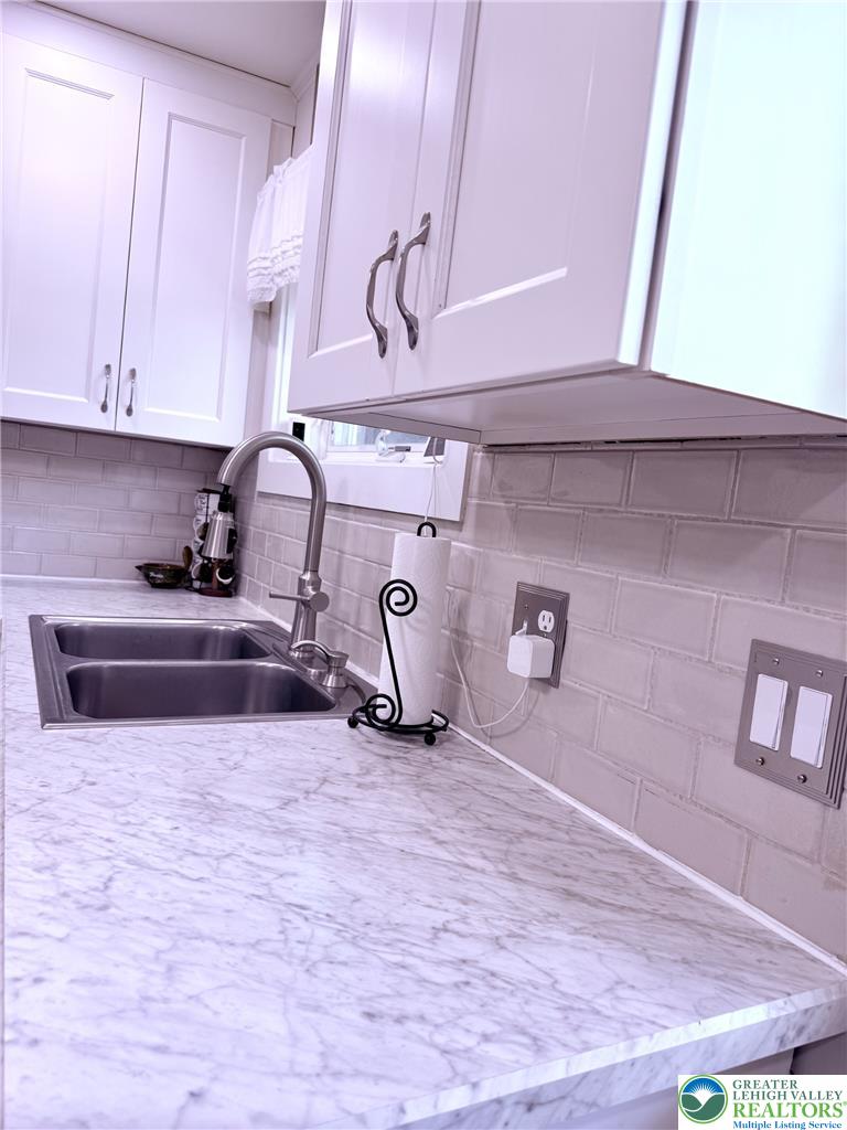 1275 Macada Road Bethlehem, PA 18017 - Photo 32 of 87 a kitchen with a sink and cabinets