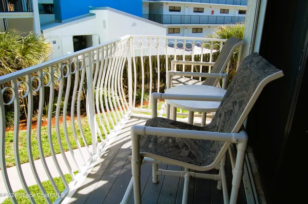 a view of balcony with furniture