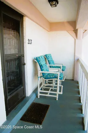 a dining room with furniture and a rug