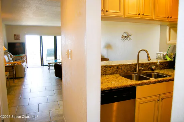 a kitchen with a sink and a refrigerator