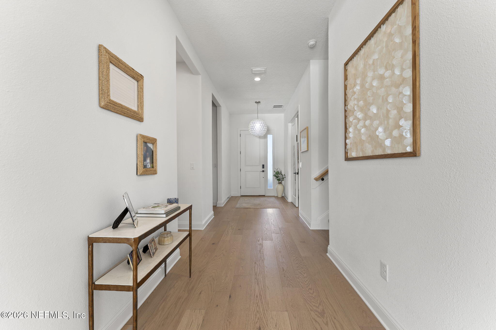 101 Elm Br Road St. Johns, FL 32259 - Photo 6 of 77 a view of a hallway with wooden floor and staircase