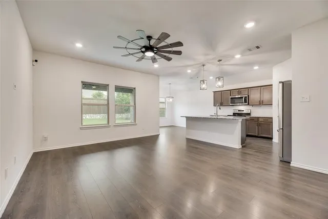 a bathroom with a double vanity sink toilet mirror and bathtub