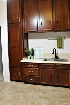 a kitchen with a sink and cabinets