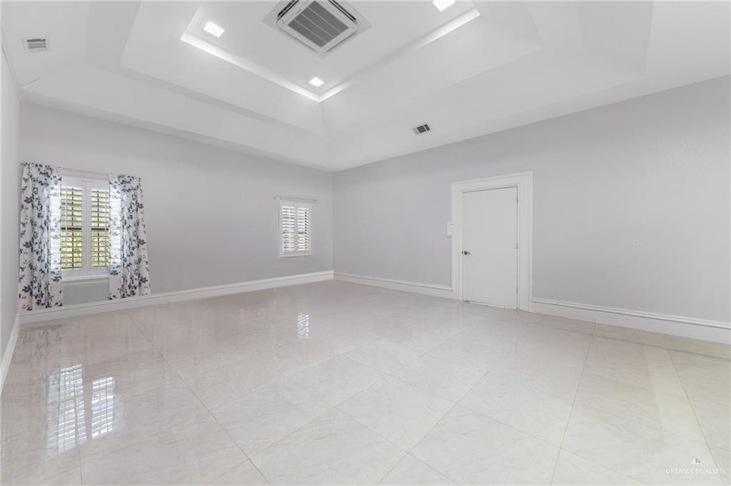 10409 North Ware Road McAllen, TX 78504 - Photo 16 of 45 wooden floor in an empty room with a window